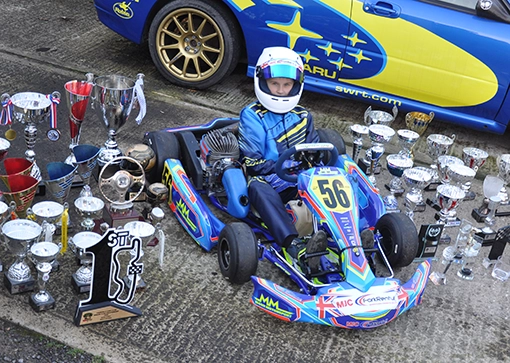 Ben Crossley surrounded by cups